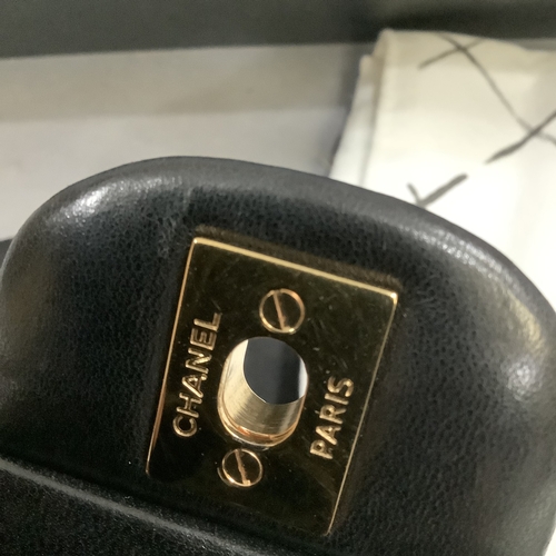 304 - A Chanel black quilted leather single flap bag with double chain strap, 25cm wide, together with aut... 
