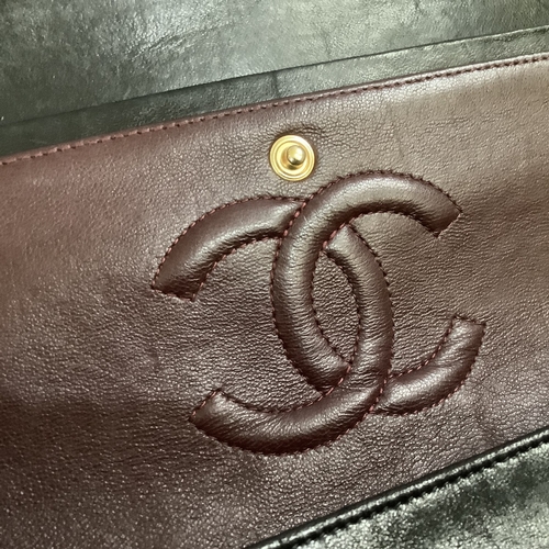 304 - A Chanel black quilted leather single flap bag with double chain strap, 25cm wide, together with aut... 