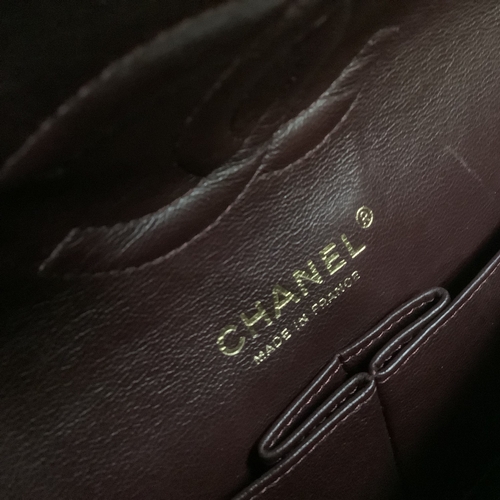 304 - A Chanel black quilted leather single flap bag with double chain strap, 25cm wide, together with aut... 