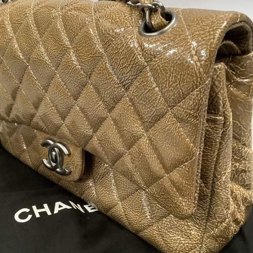 305 - A Chanel caramel crinkled patent leather single flap bag with double-chain strap, 25cm wide, with au... 