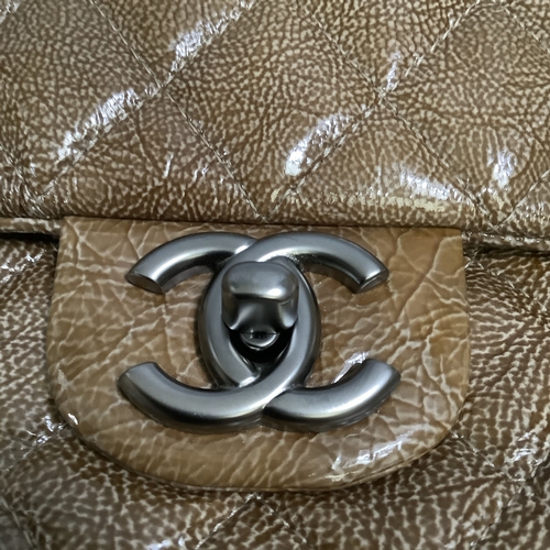 305 - A Chanel caramel crinkled patent leather single flap bag with double-chain strap, 25cm wide, with au... 