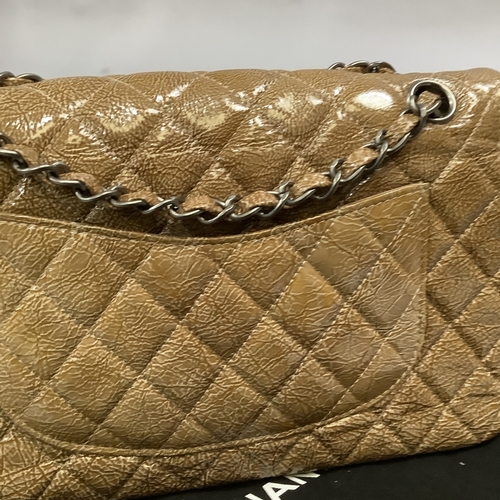 305 - A Chanel caramel crinkled patent leather single flap bag with double-chain strap, 25cm wide, with au... 
