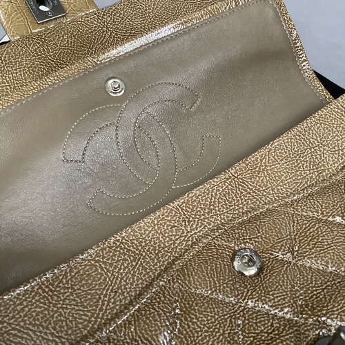 305 - A Chanel caramel crinkled patent leather single flap bag with double-chain strap, 25cm wide, with au... 