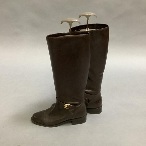 293 - A pair of Etienne Aigner brown leather boots with buckle detail at the ankle