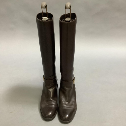 293 - A pair of Etienne Aigner brown leather boots with buckle detail at the ankle
