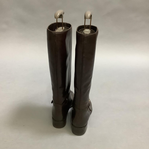 293 - A pair of Etienne Aigner brown leather boots with buckle detail at the ankle