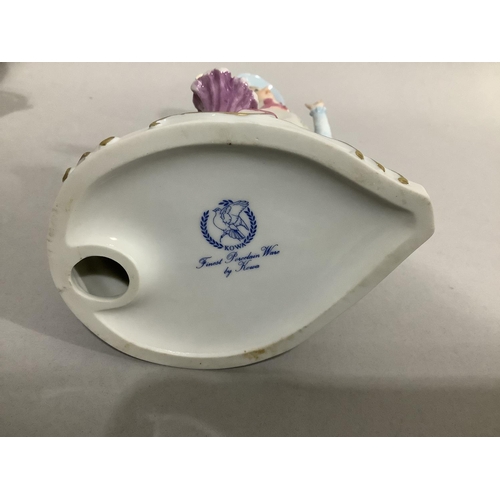 107 - A collection of continental china figures including girl sitting on a tree stump with basket of flow... 