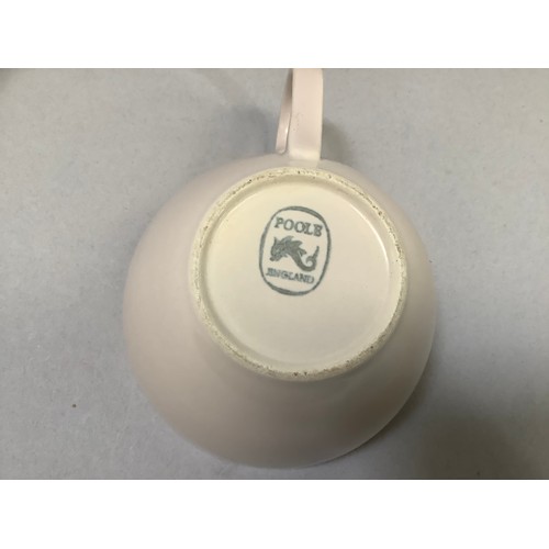 86 - A Poole pottery two-tone coffee ware including coffee pot, four coffee cups and five saucers, milk j... 