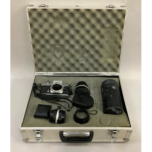 62 - A metal camera case containing a Nikkormat body, Nikon 85mm lens, Nikkor 200mm lens, a Nikon 50mm le... 