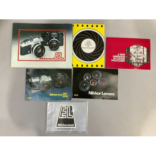 62 - A metal camera case containing a Nikkormat body, Nikon 85mm lens, Nikkor 200mm lens, a Nikon 50mm le... 