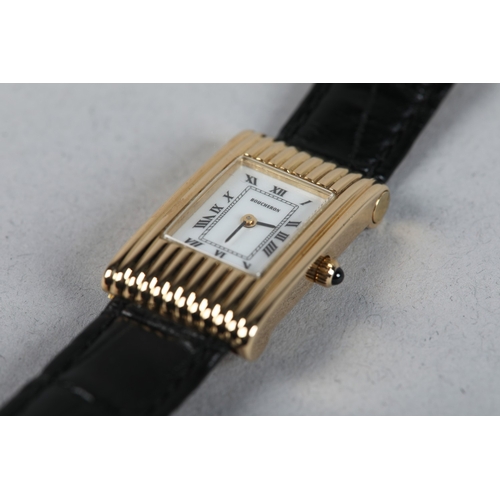 333 - A BOUCHERON LADY'S REFLET QUARTZ WRISTWATCH, in 18ct gold case no. AE12146, rectangular white cerami... 