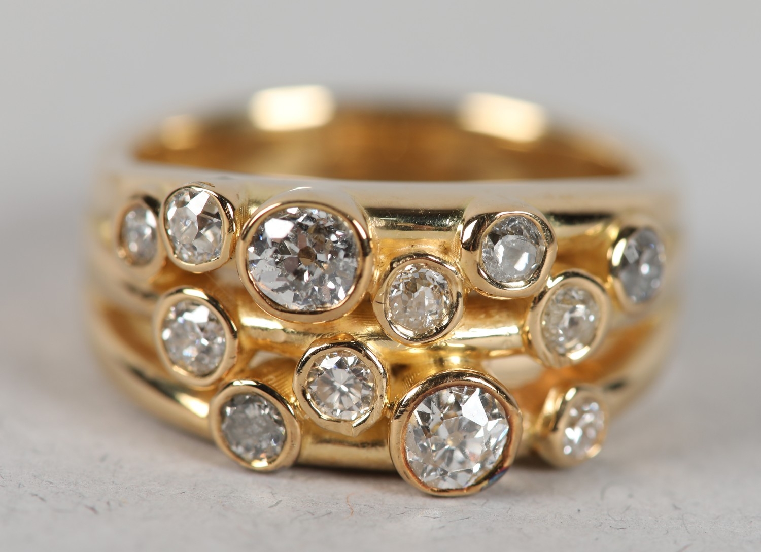 A DIAMOND RING, collet set with Old European and brilliant cut diamonds ...