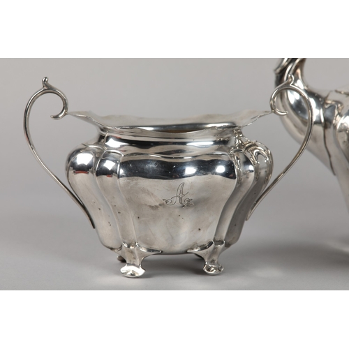 222 - AN EDWARD VII FOUR PIECE SILVER TEA SET, Chester 1906-1907 for Walker and Hall, pattern number 53478... 