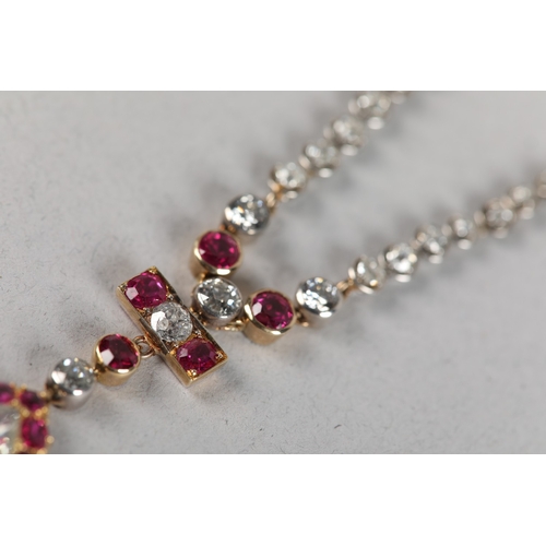 258 - A LATE 19TH CENTURY RUBY AND DIAMOND PENDANT, the principal pear shaped diamond set within a surroun... 