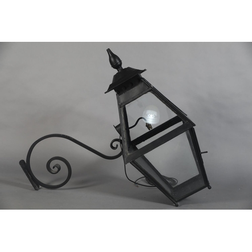 25 - AN EXTERNAL SIX PANEL METAL AND GLAZED LANTERN with spire finial, converted to electricity and with ... 