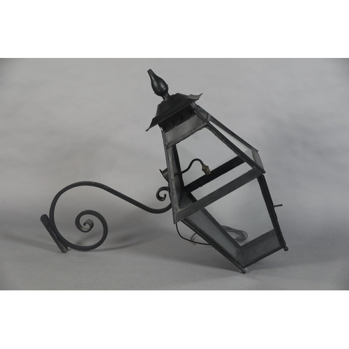 25 - AN EXTERNAL SIX PANEL METAL AND GLAZED LANTERN with spire finial, converted to electricity and with ... 