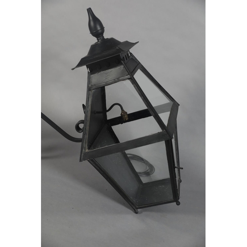 25 - AN EXTERNAL SIX PANEL METAL AND GLAZED LANTERN with spire finial, converted to electricity and with ... 