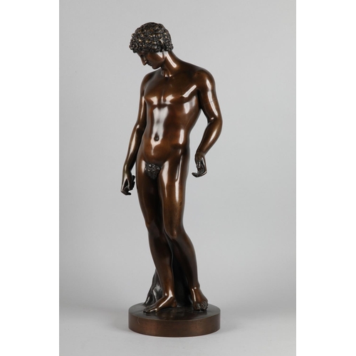76 - A PATINATED BRONZE FIGURE OF ANTINOUS, standing on a circular base, after the antique, foundry stamp...