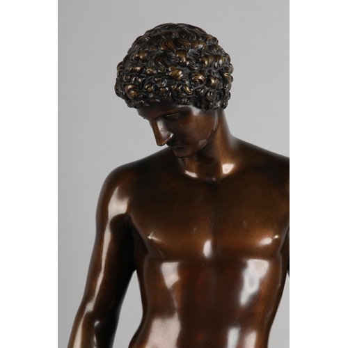 76 - A PATINATED BRONZE FIGURE OF ANTINOUS, standing on a circular base, after the antique, foundry stamp... 
