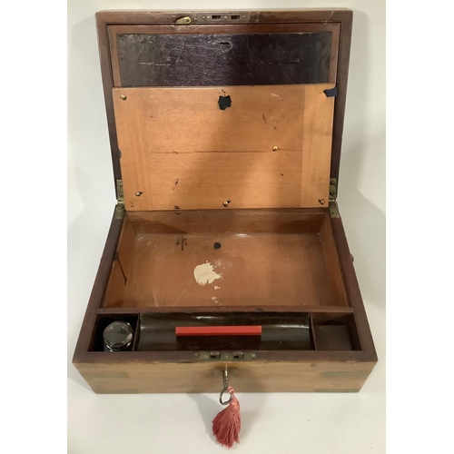 34 - A 19TH CENTURY MAHOGANY AND BRASS BOUND WRITING SLOPE, with vacant brass cartouche to the lid and si... 