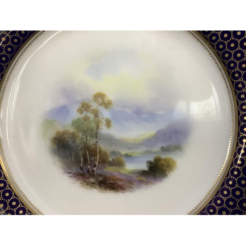 91 - A ROYAL WORCESTER CABINET PLATE, painted to the centre with a lake and mountain landscape by Harry D... 