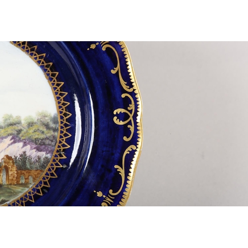 113 - A MANSFIELD-TORKSEY PORCELAIN PLATE, painted by William Billingsley c.1800-1807, man with dog in a l... 