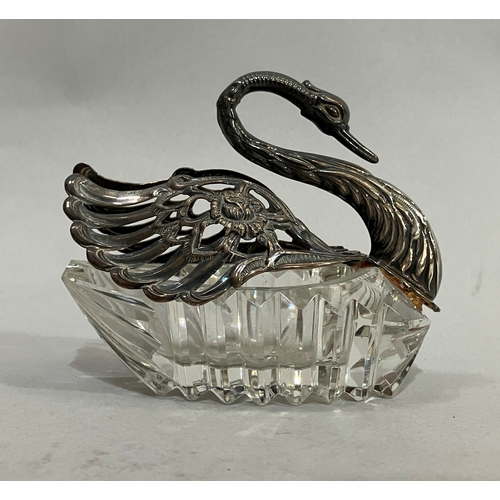 12 - A silver mounted and cut glass bon bon dish in the form of a swan, .925 import mark, 9.5cm high