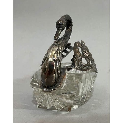 12 - A silver mounted and cut glass bon bon dish in the form of a swan, .925 import mark, 9.5cm high