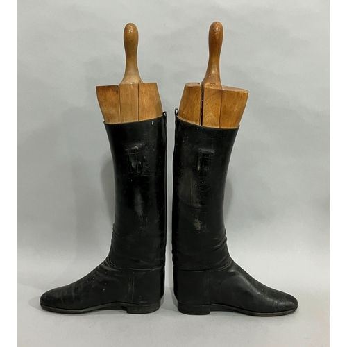 25 - A pair of vintage black leather riding boots with trees