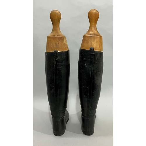 25 - A pair of vintage black leather riding boots with trees