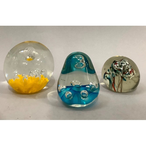 38 - A 19th century glass linen smoother together with five various glass paper weights one inset with wa... 