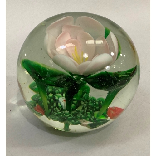 38 - A 19th century glass linen smoother together with five various glass paper weights one inset with wa... 