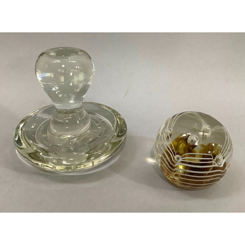 38 - A 19th century glass linen smoother together with five various glass paper weights one inset with wa... 
