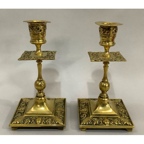 43 - A Victorian brass chamber stick with pierced handle of square outline with rounded corners and beade... 