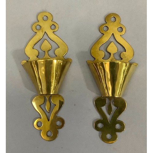44 - A pair of Victorian brass spill pockets 18.5cm high, together with a pair of brass candlesticks of p... 