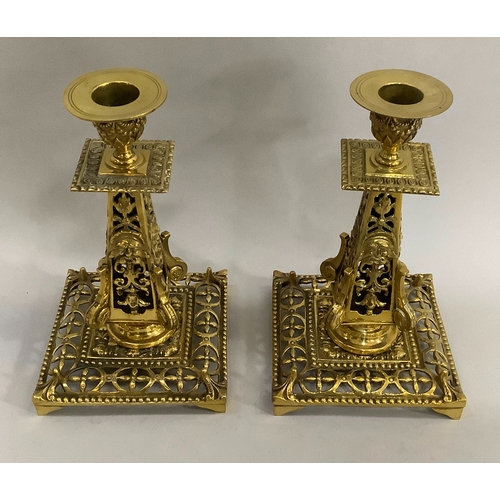 44 - A pair of Victorian brass spill pockets 18.5cm high, together with a pair of brass candlesticks of p... 