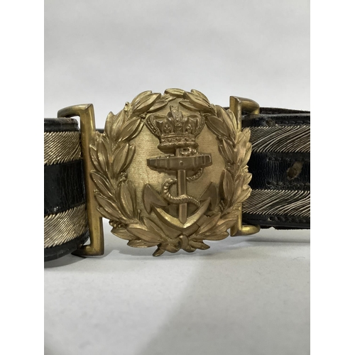 42 - A Victorian naval dress belt with fouled anchor and laurel wreath buckle, a cartridge/cordite carrie... 