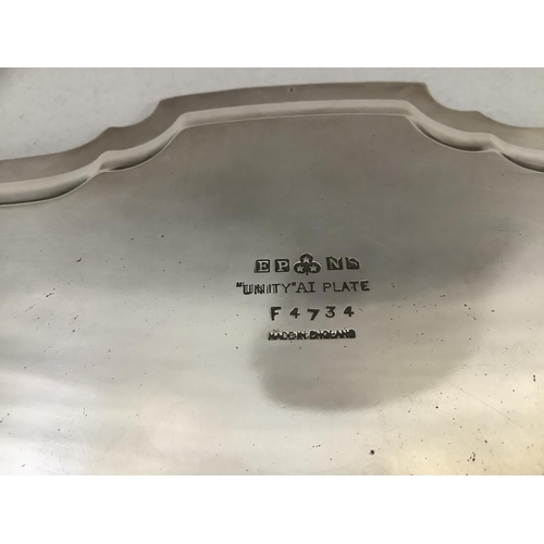 17 - A silver plated tray of bracketed outline with piecrust rim on three scroll feet, 35.5cm diameter