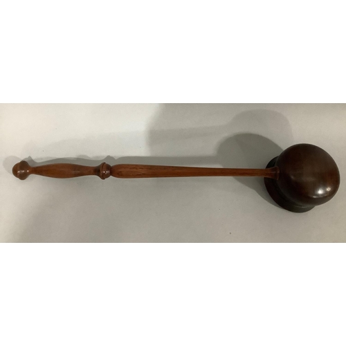6 - A large treen ladle on turned handle, 46cm long