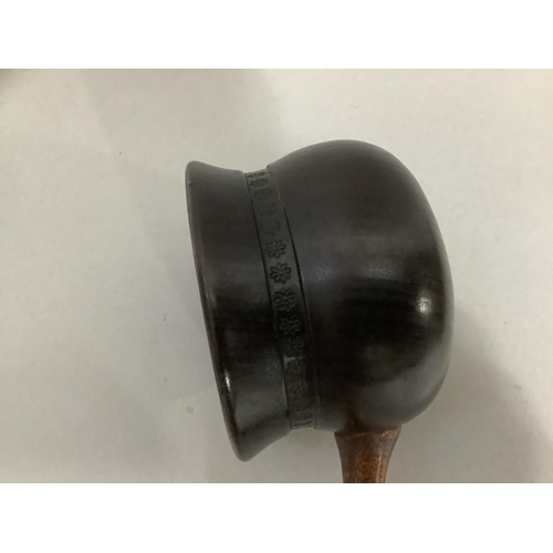 6 - A large treen ladle on turned handle, 46cm long
