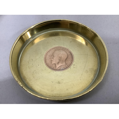 47 - A pair of World War I trench art ash trays, both brass shell case bases with George V pennies insert... 