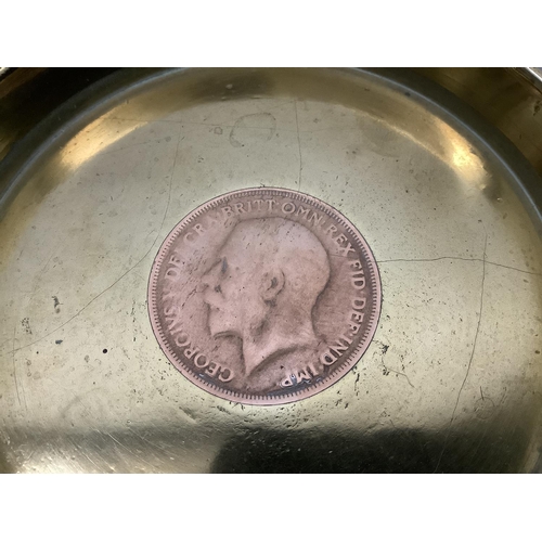 47 - A pair of World War I trench art ash trays, both brass shell case bases with George V pennies insert... 