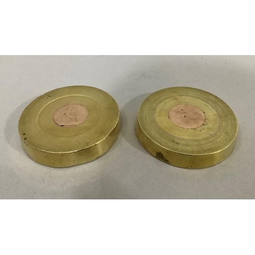 47 - A pair of World War I trench art ash trays, both brass shell case bases with George V pennies insert... 