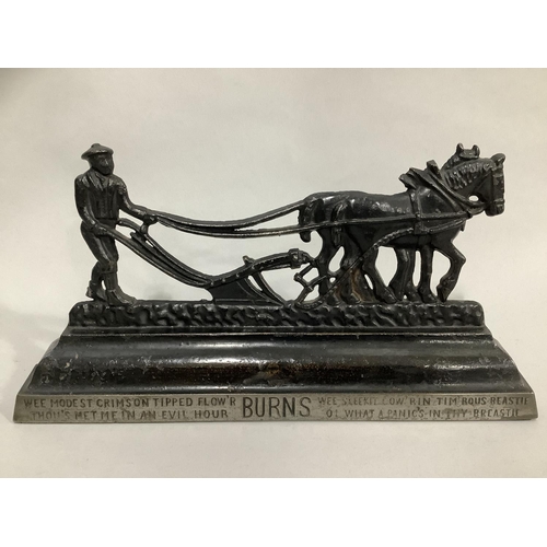 38 - A pair of Victorian cast iron hearth ornaments in the form of a ploughman and team, the base lettere... 