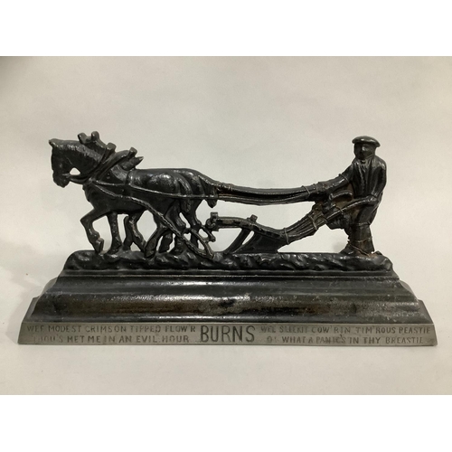 38 - A pair of Victorian cast iron hearth ornaments in the form of a ploughman and team, the base lettere... 
