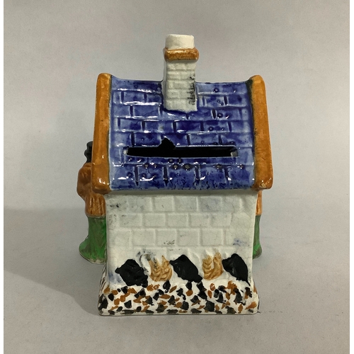8 - A 19th century Staffordshire cottage moneybox, 12.5cm