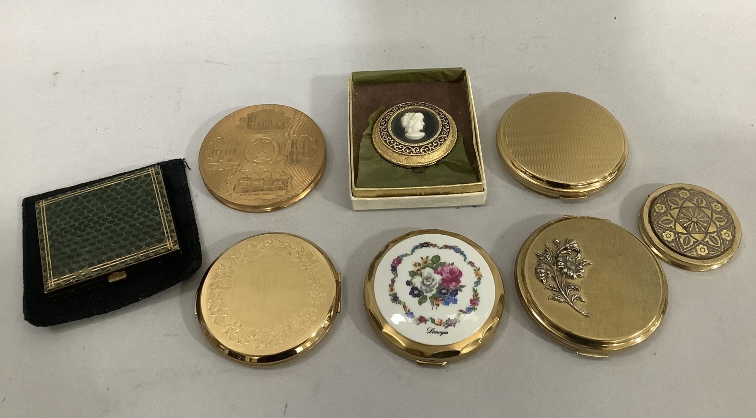 A collection of mainly gilt metal compacts by Stratton and others