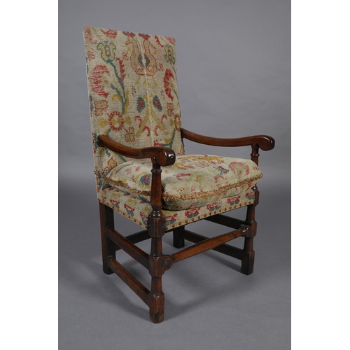 272 - A LATE 17TH CENTURY YEW-WOOD OPEN ARMCHAIR, the high back and cushioned seat upholstered in rug fabr... 