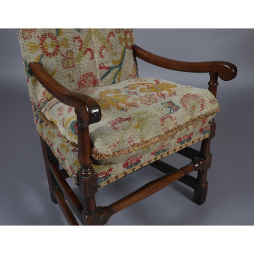 272 - A LATE 17TH CENTURY YEW-WOOD OPEN ARMCHAIR, the high back and cushioned seat upholstered in rug fabr... 