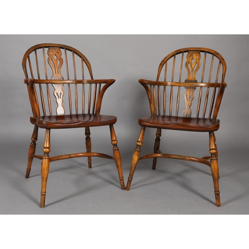 283 - A PAIR OF LOW BACK ELM WINDSOR ARMCHAIRS BY BATHEASTON, railed backs, shepherd's crook arm uprights,... 